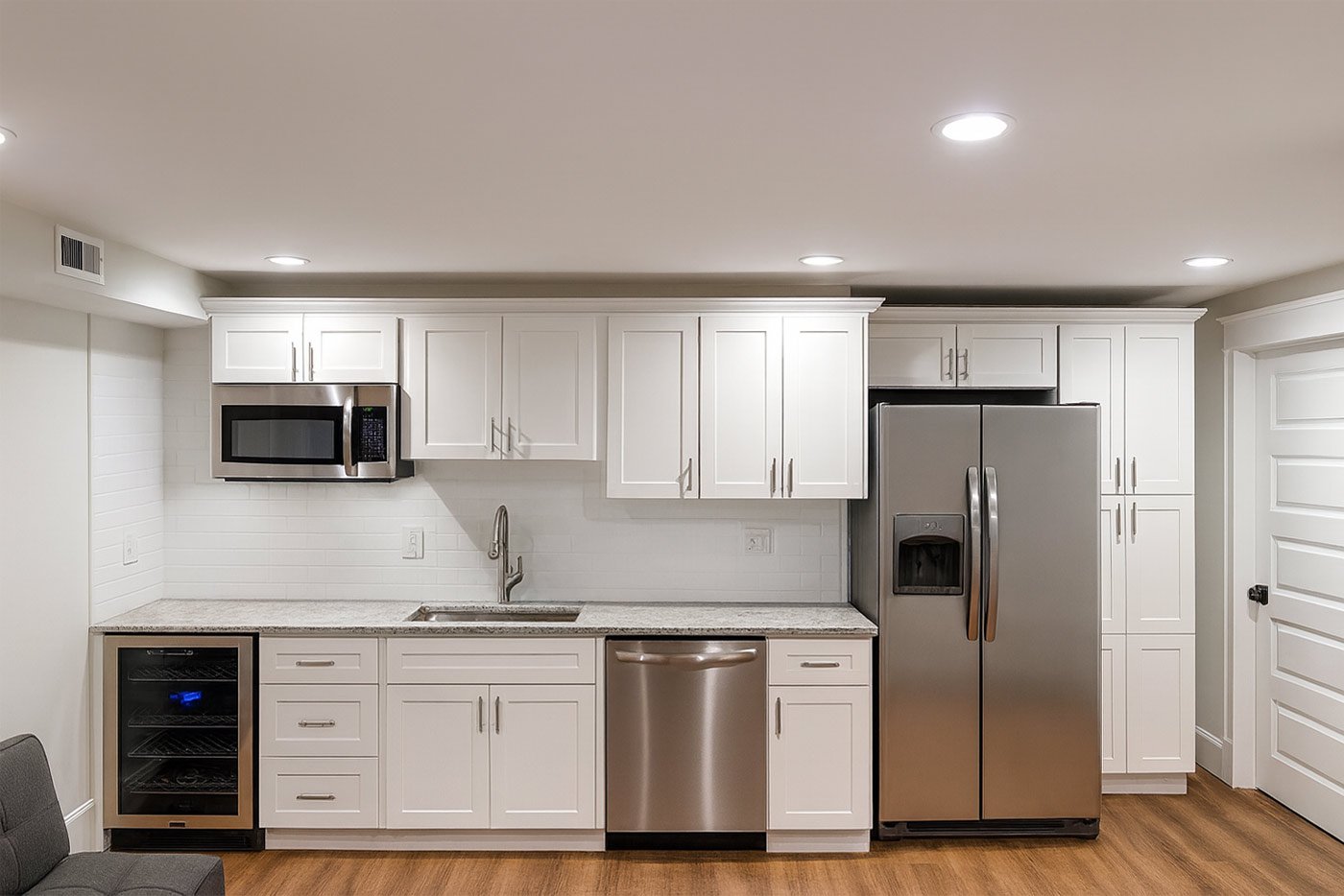 Kitchen in remodeled basement near Boston, MA by Honorato Company Kitchen in remodeled basement near Boston, MA by Honorato Company
