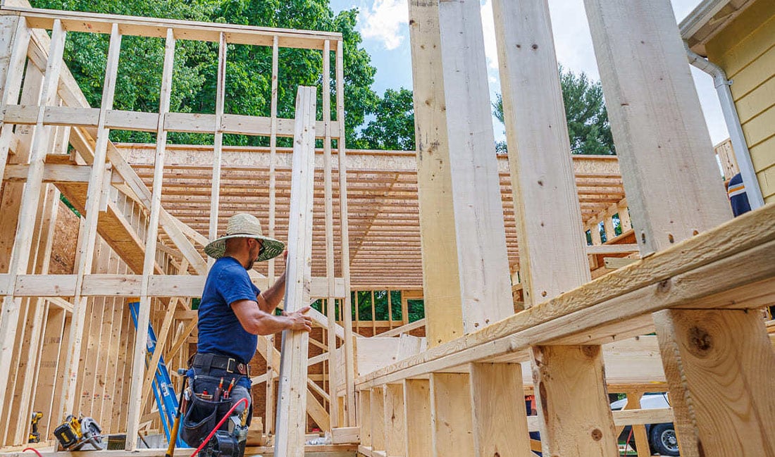 Contractor working on framing of new construction near Boston, MA by Honorato Company-1