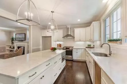 Island with storage in Boston kitchen remodel by Honorato Company