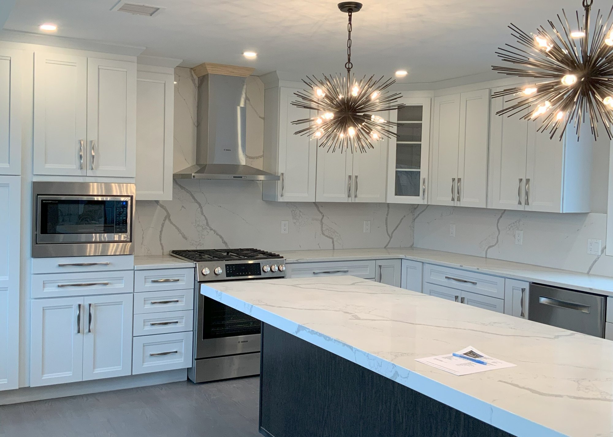 Kitchen island in Winchester, MA custom home by Honorato Company