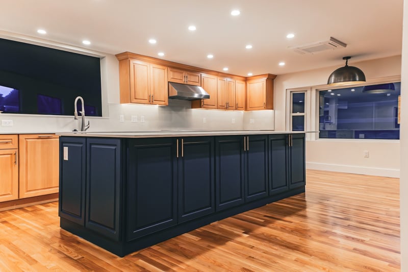 Large black kitchen island in Greater Boston kitchen remodel by Honorato Company