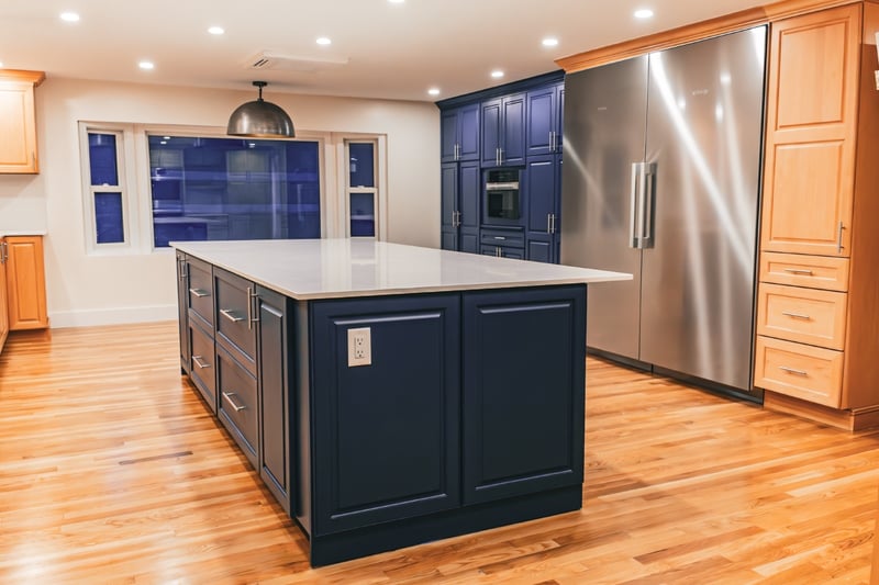 remodeled kitchen with large island and industrial fridge