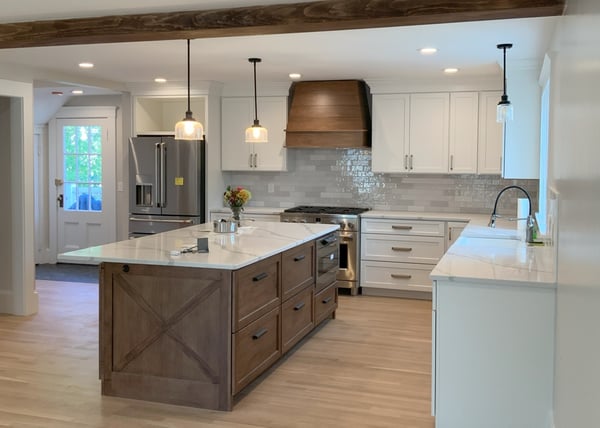 rustic wood and white kitchen with island and pendant lights in Greater Boston, MA by Honorato Company