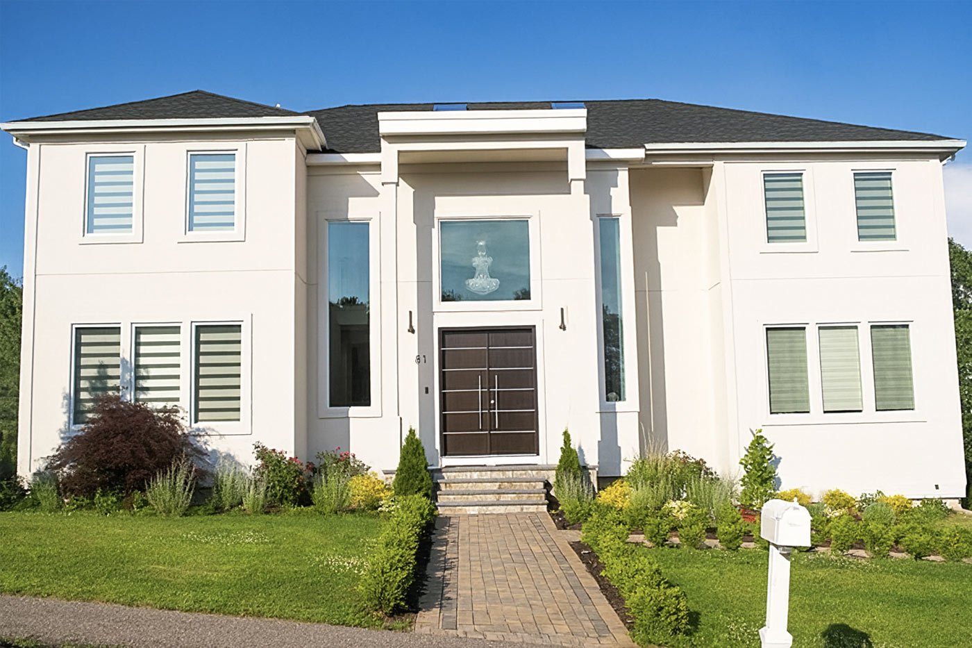 Modern two-story stucco home with manicured landscaping in Greater Boston Modern two-story stucco home with manicured landscaping in Greater Boston
