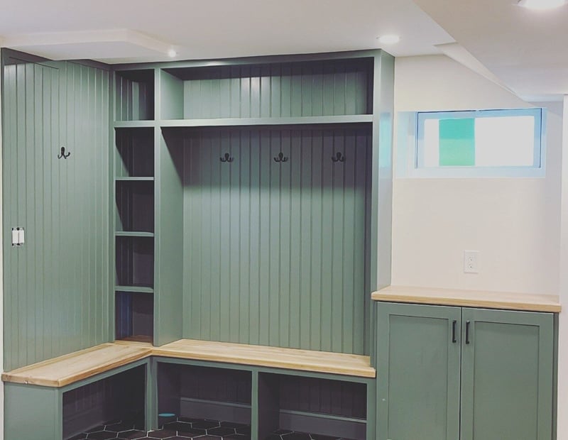 Mudroom remodel in Boston, MA by Honorato Company with built-in seating and shelving-1