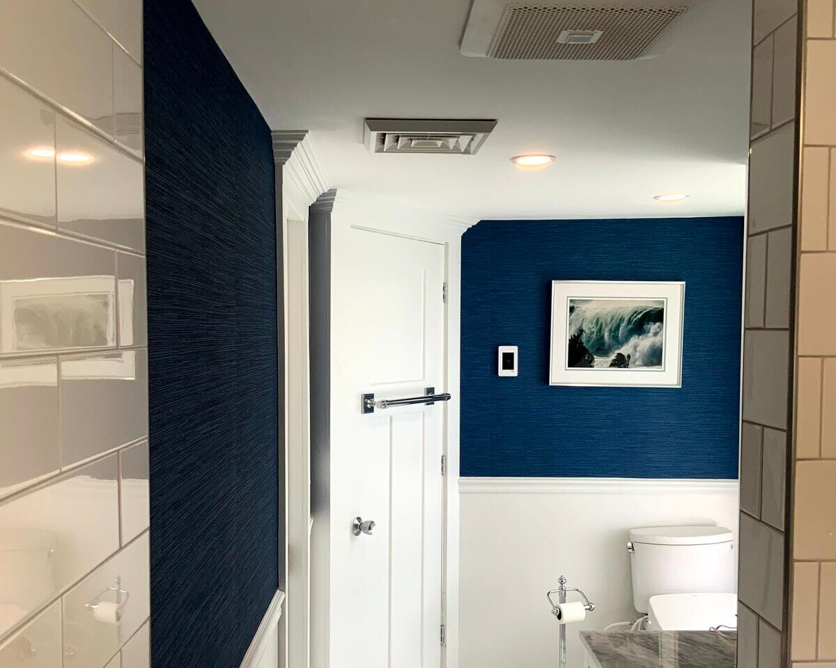 View of two tone bathroom remodel in Greater Boston, MA by Honorato Company