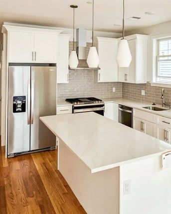 white kitchen with pendant lights and subway tile in boston-1