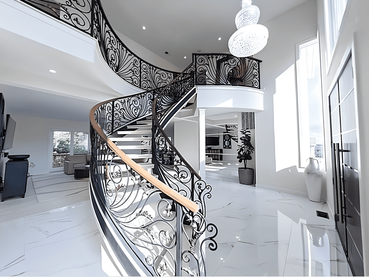 Curved staircase in Boston home by Honorato Company