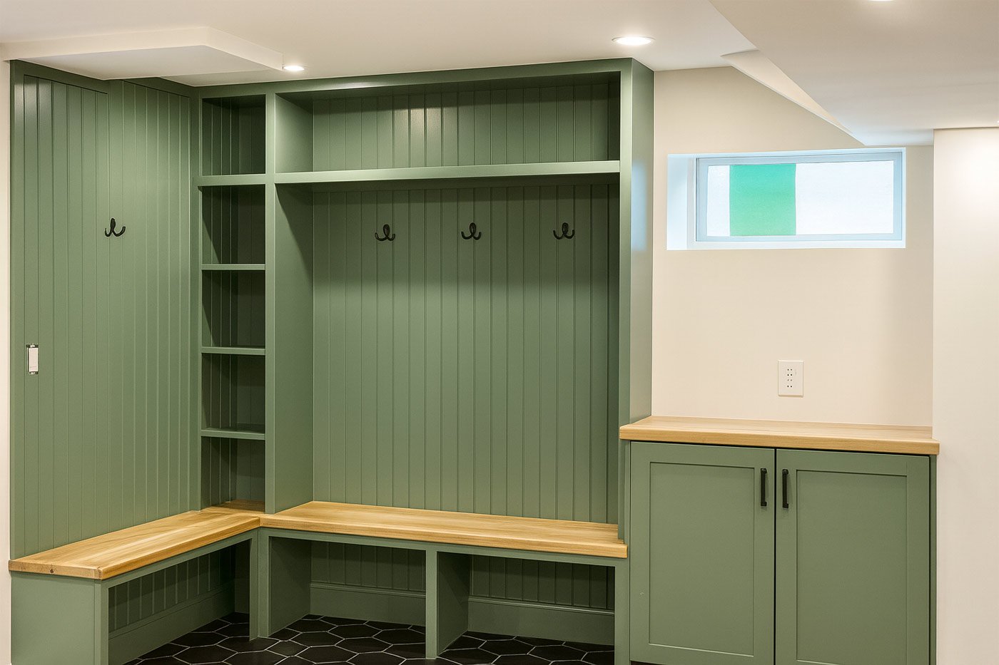Mudroom remodel in Boston, MA by Honorato Company with built-in seating and shelving-1